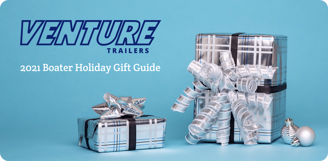 Image of presents wrapped in silver paper on blue background.